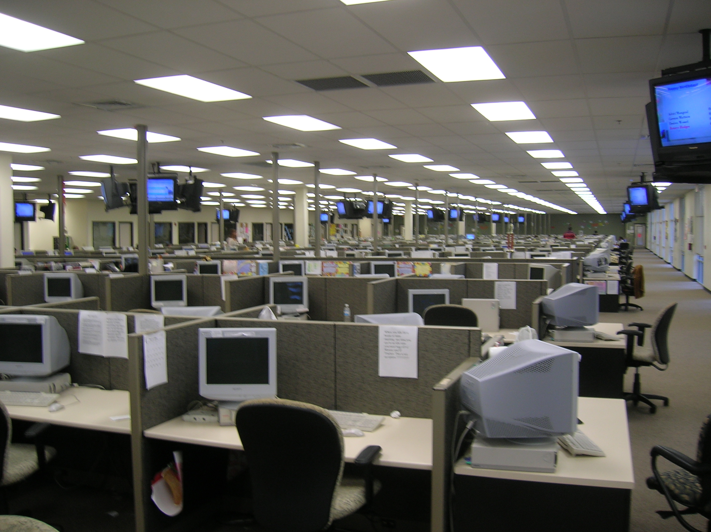 Rows of customer-service workstations in a real call centre